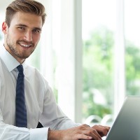 person typing on laptop